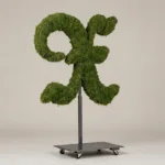 Monogram letter X topiary in Custom style, packed with green moss, on an adjustable stand