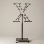 Monogram letter X topiary frame in Roman style, bare galvanized steel on an adjustable stand