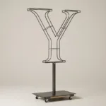 Monogram letter Y topiary frame in Cinzel style, bare galvanized steel on an adjustable stand