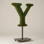 Monogram letter Y topiary in Cinzel style, packed with green moss, on an adjustable stand