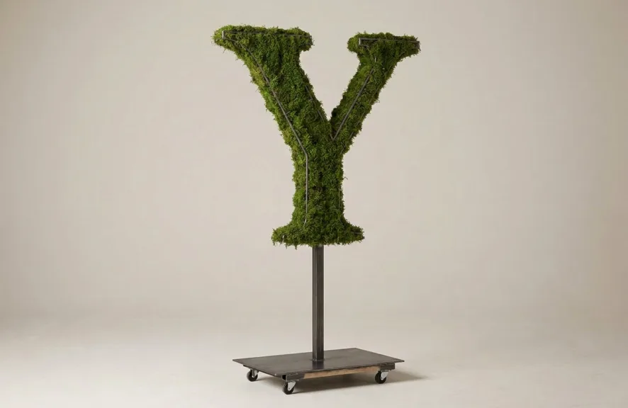 Monogram letter Y topiary in Cinzel style, packed with green moss, on an adjustable stand