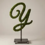 Monogram letter Y topiary in Flowing script style, packed with green moss, on an adjustable stand