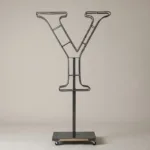 Monogram letter Y topiary frame in Roman style, bare galvanized steel on an adjustable stand