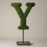 Monogram letter Y topiary in Roman style, packed with green moss, on an adjustable stand