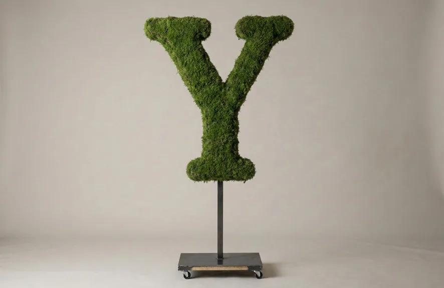 Monogram letter Y topiary in Roman style, packed with green moss, on an adjustable stand