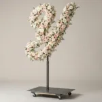 Monogram letter Y topiary in script style, covered in pink and white roses