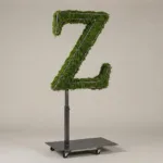 Monogram letter Z topiary in Cinzel style, packed with green moss, on an adjustable stand