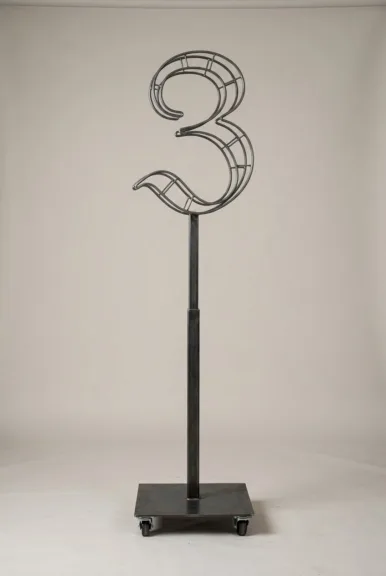 Monogram letter Z topiary frame in Custom style, bare galvanized steel on an adjustable stand