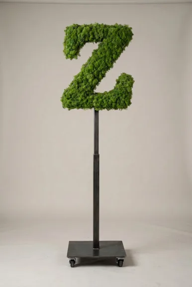 Monogram letter Z topiary in Custom style, packed with green moss, on an adjustable stand