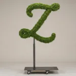 Monogram letter Z topiary in Flowing script style, packed with green moss, on an adjustable stand