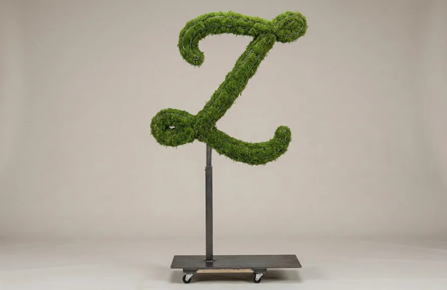 Monogram letter Z topiary in Flowing script style, packed with green moss, on an adjustable stand