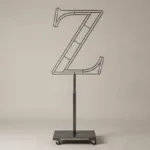 Monogram letter Z topiary frame in Roman style, bare galvanized steel on an adjustable stand