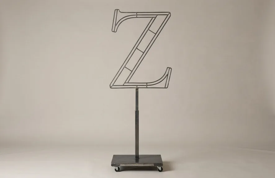 Monogram letter Z topiary frame in Roman style, bare galvanized steel on an adjustable stand