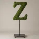 Monogram letter Z topiary in Roman style, packed with green moss, on an adjustable stand