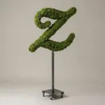 Monogram letter Z topiary in Script style, packed with green moss, on an adjustable stand