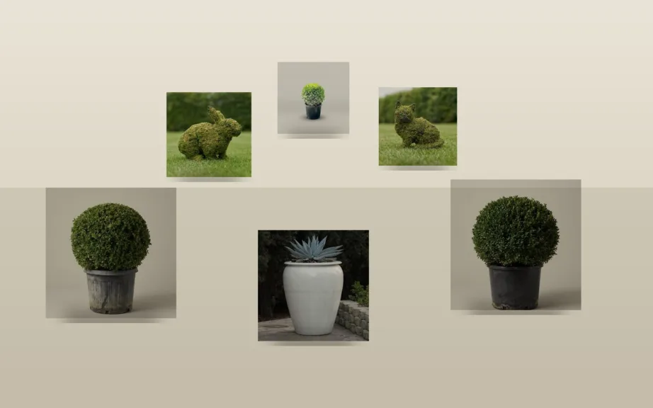 Boxwood ball topiary in planters, a mossed rabbit and kitten, a globe topiary and a smooth urn arranged at an entrance